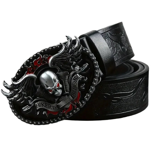 Black leather belt with a detailed skull and wings buckle on a gray surface